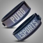 A close-up view of a PUBG esports lifting belt, showcasing the words "PUBG" and "ESPORTS" printed prominently on the belt's surface.