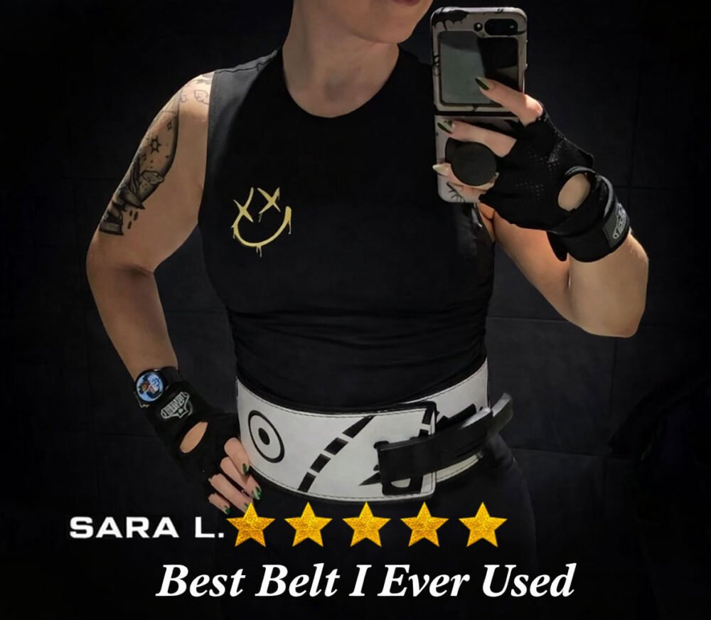 Woman in a gym wearing a custom white leather lever weightlifting belt with black graphic illustrations