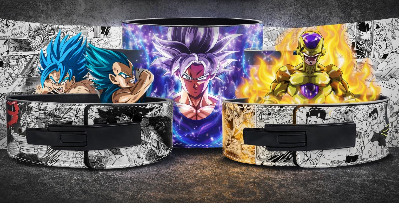 Three custom weightlifting lever belts featuring Dragon Ball anime designs, including a center belt showing Ultra Instinct Goku with a glowing purple aura, a left belt covered in black-and-white manga panels below Super Saiyan Blue Goku and Vegeta, and a right belt with manga panels beneath a Golden Frieza graphic, both equipped with black lever buckles.