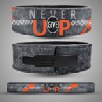 Never Give Up weightlifting belt showing grey and orange artwork, black lever buckle and full-length strap