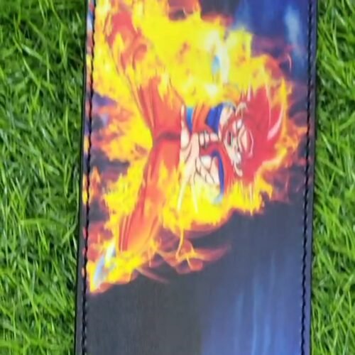 Video cover showing red-haired Goku artwork and orange flames on the belt laid on grass