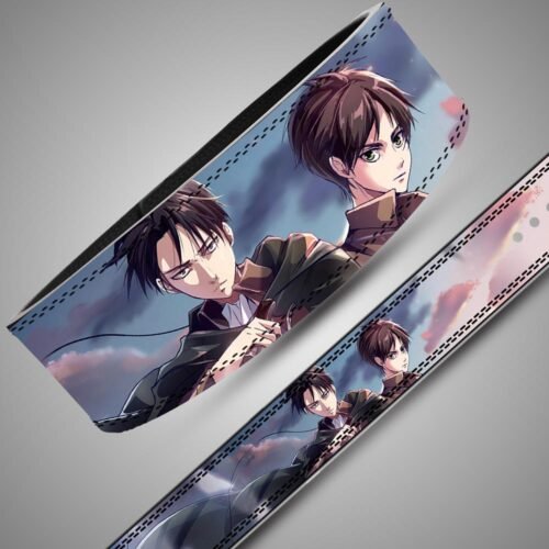 Angled close-up of an Attack on Titan custom weightlifting belt featuring anime characters Levi Ackerman and Eren Yeager against a cloudy sky, finished with dark double stitching