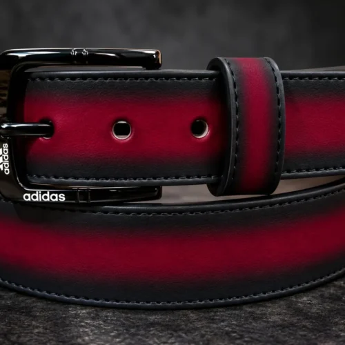 Burgundy pant belt with black buckle and stitched edges