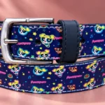 Navy Powerpuff Girls leather pant belt with character print and silver-tone buckle, coiled view